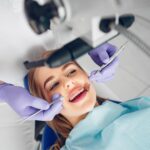 beautiful-girl-sitting-dentist-s-office-min